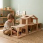 Preview: Kind spielt mit Puppenhaus und Terrassenerweiterung aus Holz