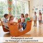 Preview: Kinder spielen gemeinsam auf Holz Wippe im Kindergarten fördert soziale Entwicklung