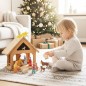 Preview: Kind spielt mit der Weihnachtskrippe und den Figuren und Tieren aus massivem Holz im Wohnzimmer