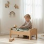 Preview: Puppenwiege Puppenbett - Kleinkind legt Puppe abends zu Bett
